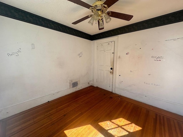 91-93 Mulberry St, Springfield, MA 01105 - empty room with baseboards, ceiling fan, wood finished floors, and visible vents