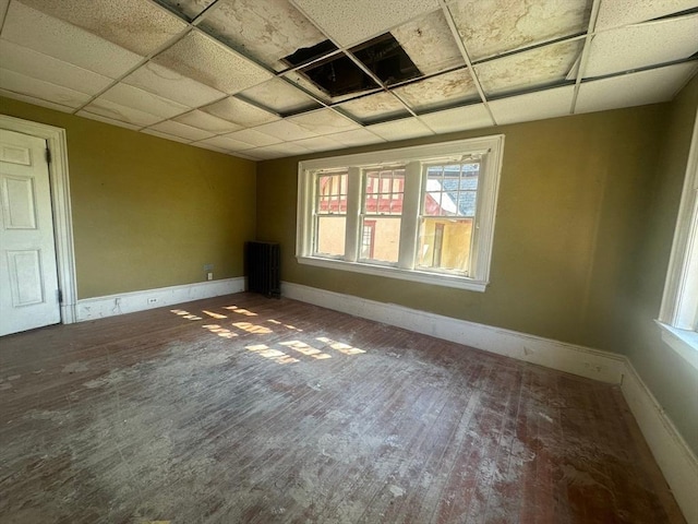 91-93 Mulberry St, Springfield, MA 01105 - empty room with baseboards, a drop ceiling, and wood finished floors