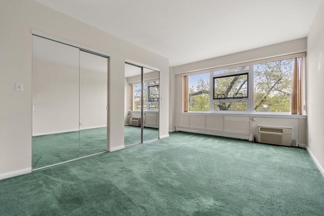 unfurnished bedroom with baseboards, a baseboard radiator, multiple closets, and carpet floors