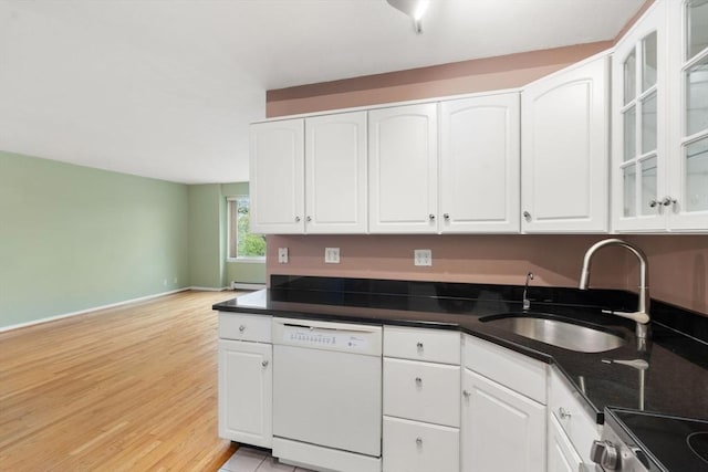 kitchen with white cabinets, dishwasher, range, and a sink