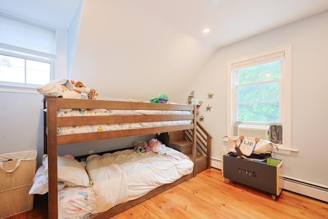 43 Thompson St, Maynard, MA 01754 - bedroom featuring wood finished floors, lofted ceiling, baseboard heating, cooling unit, and recessed lighting