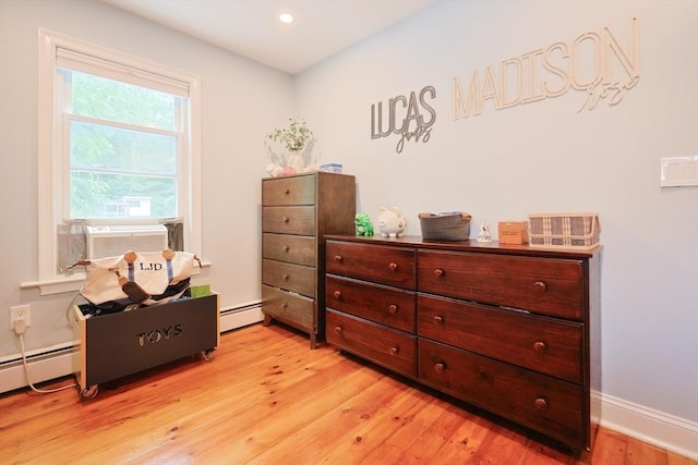 43 Thompson St, Maynard, MA 01754 - bedroom featuring light wood-style flooring, cooling unit, a baseboard heating unit, and recessed lighting