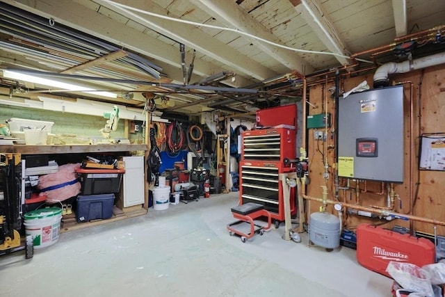 43 Thompson St, Maynard, MA 01754 - basement with a workshop area and water heater