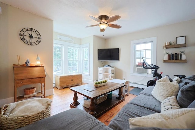 43 Thompson St, Maynard, MA 01754 - living room with ceiling fan, a baseboard radiator, and light wood finished floors