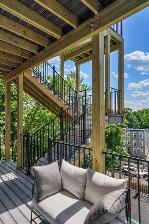 exterior space with outdoor lounge area and stairway