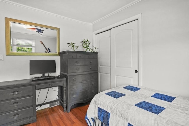 132 Biscayne St, Leominster, MA 01453 - bedroom featuring crown molding, dark wood-style flooring, and a closet