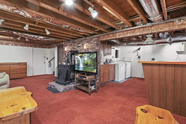 132 Biscayne St, Leominster, MA 01453 - finished below grade area featuring separate washer and dryer, a wood stove, carpet flooring, and a bar