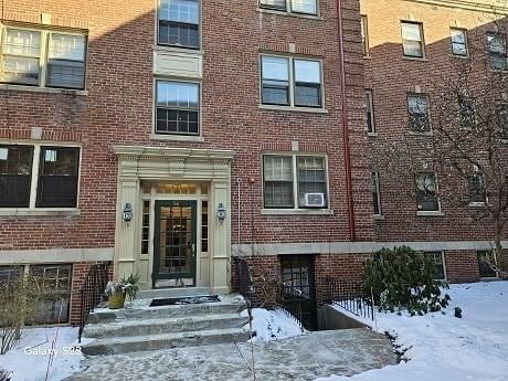 view of snow covered property entrance