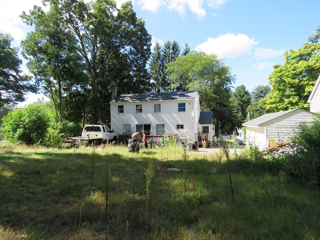 rear view of house featuring a deck