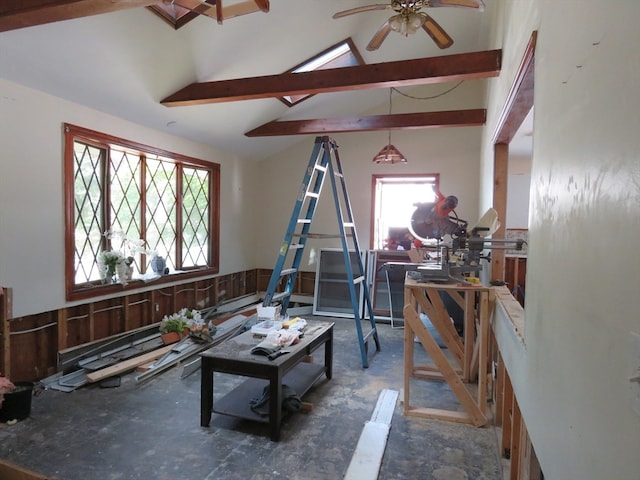 misc room featuring ceiling fan and lofted ceiling with beams