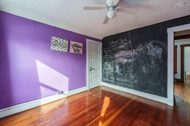 unfurnished room featuring hardwood / wood-style flooring and ceiling fan