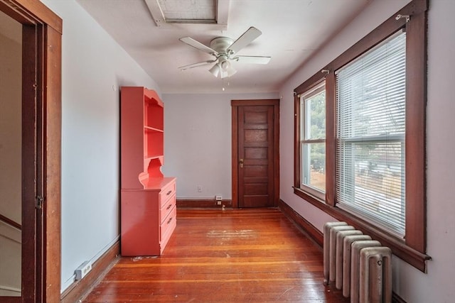 hall with hardwood / wood-style floors and radiator