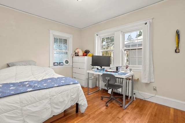 bedroom with wood-type flooring