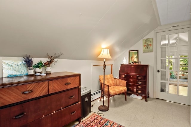 living area with a baseboard radiator and lofted ceiling