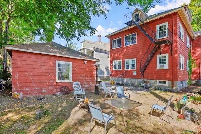 rear view of house with a patio