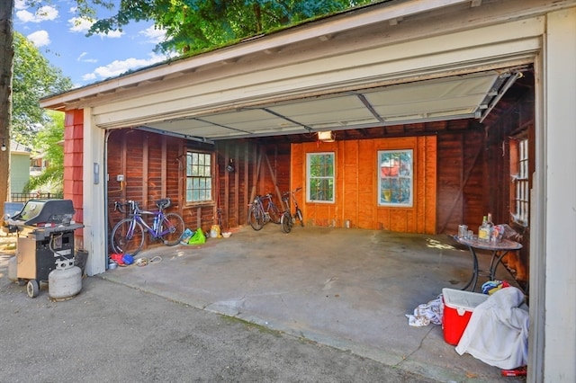 garage featuring wooden walls