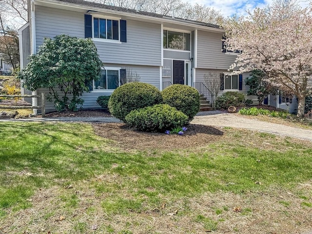 bi-level home with a front yard