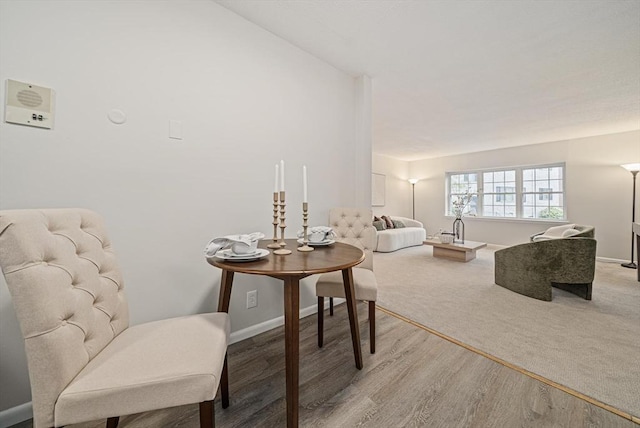 sitting room featuring baseboards and wood finished floors