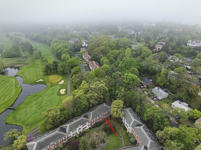 aerial overview of property's location with a large body of water and a local golf course