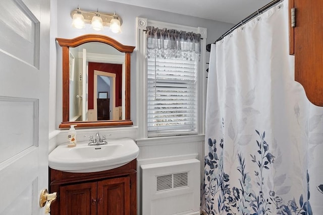 bathroom with vanity and curtained shower