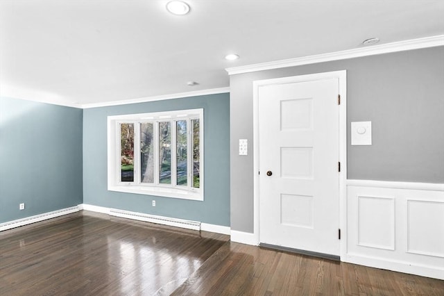 foyer with crown molding, a baseboard heating unit, recessed lighting, and wood finished floors