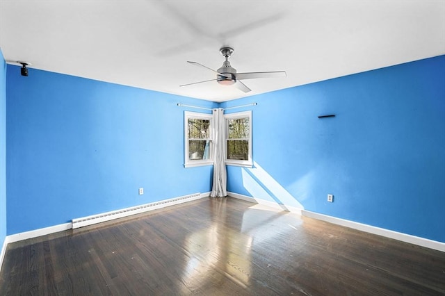 empty room featuring baseboards, ceiling fan, wood finished floors, and baseboard heating