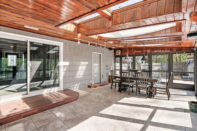 sunroom featuring a skylight and plenty of natural light
