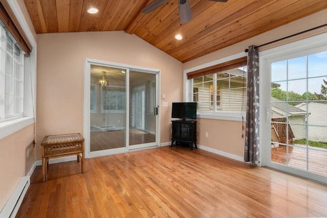 unfurnished sunroom featuring a baseboard heating unit