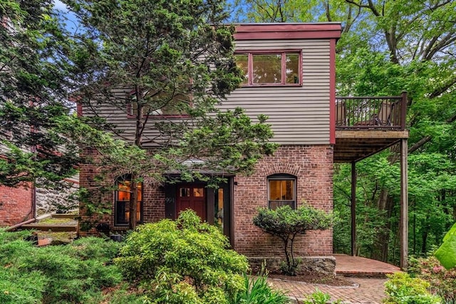994 Centre St, Boston, MA 02130 - view of front of property with brick siding and a deck