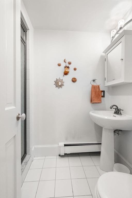 994 Centre St, Boston, MA 02130 - bathroom with a baseboard radiator, toilet, tile patterned flooring, and a sink