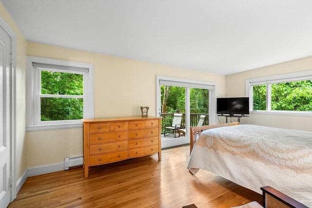 994 Centre St, Boston, MA 02130 - bedroom featuring access to outside, baseboard heating, light wood-type flooring, and baseboards