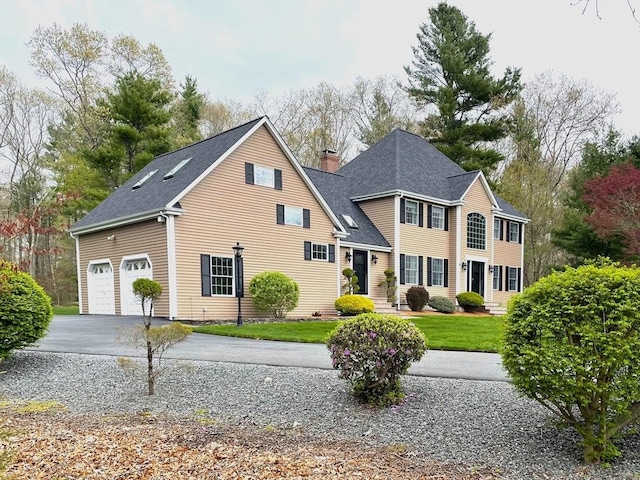 40 King Philip Dr, Rehoboth, MA 02769 - view of front of house featuring driveway, a shingled roof, a chimney, and a front yard