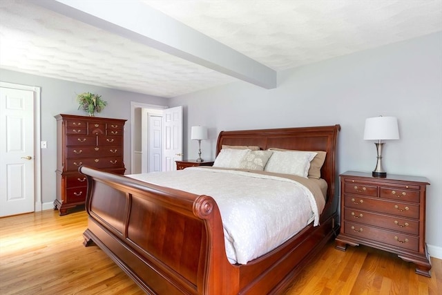 40 King Philip Dr, Rehoboth, MA 02769 - bedroom featuring light wood-type flooring, beam ceiling, and baseboards