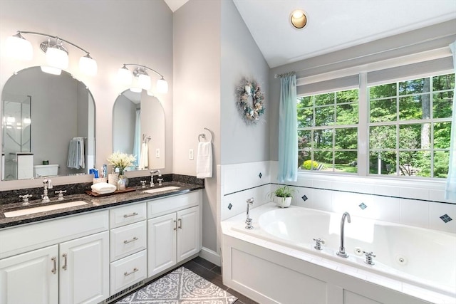 40 King Philip Dr, Rehoboth, MA 02769 - full bathroom featuring double vanity, a jetted tub, and lofted ceiling