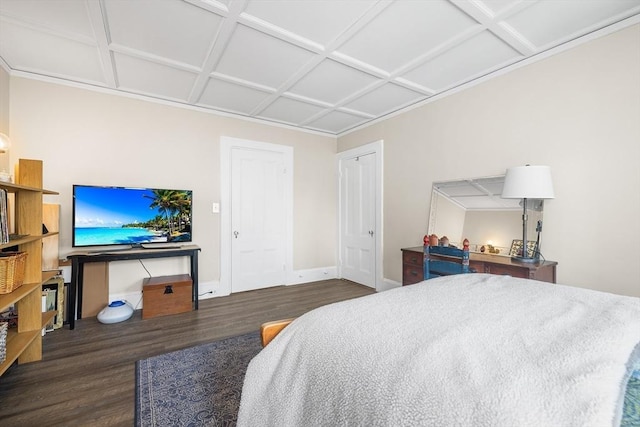 bedroom with coffered ceiling and dark hardwood / wood-style floors