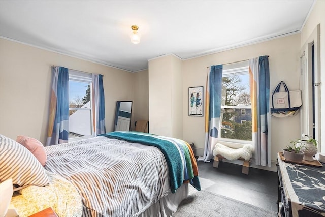 bedroom featuring multiple windows, crown molding, and carpet floors