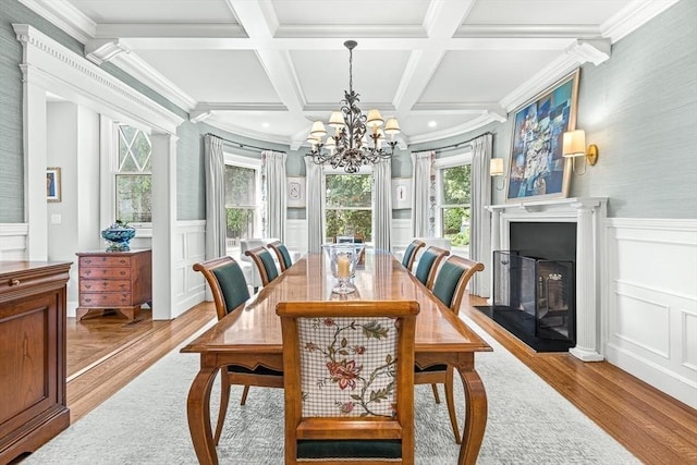 5 Stratford Rd, Winchester, MA 01890 - dining room with wood finished floors, plenty of natural light, a chandelier, a fireplace, and a decorative wall