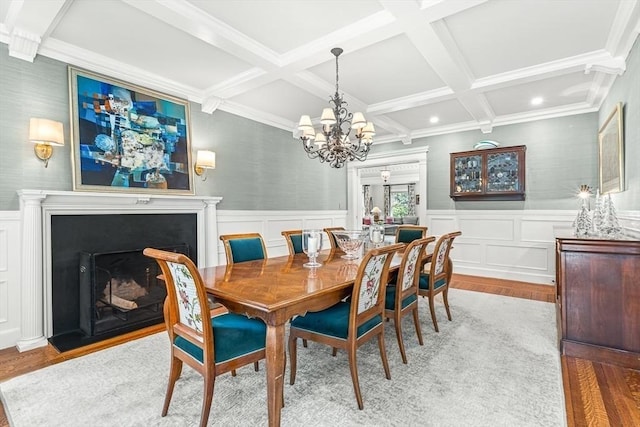 5 Stratford Rd, Winchester, MA 01890 - dining space with wood finished floors, coffered ceiling, a chandelier, beam ceiling, and a fireplace with flush hearth