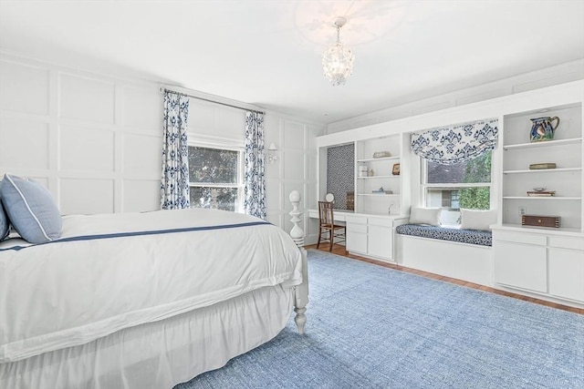 5 Stratford Rd, Winchester, MA 01890 - bedroom featuring a decorative wall and a chandelier