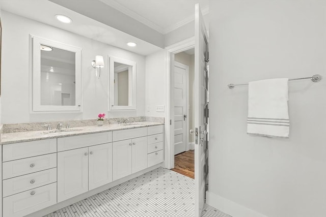 5 Stratford Rd, Winchester, MA 01890 - bathroom featuring ornamental molding, double vanity, baseboards, and recessed lighting