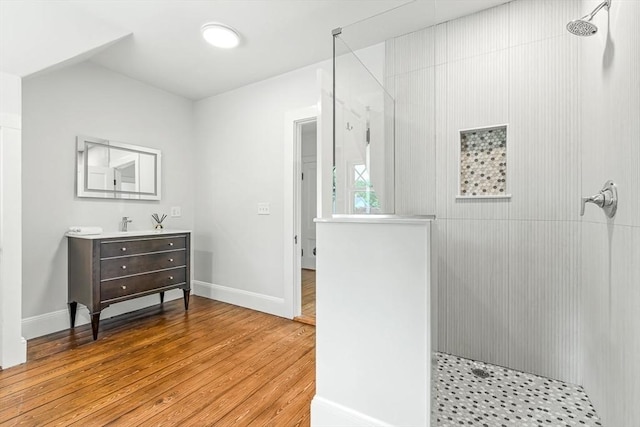5 Stratford Rd, Winchester, MA 01890 - full bath featuring walk in shower, wood-type flooring, vanity, and baseboards