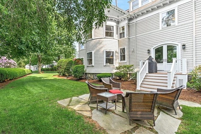 5 Stratford Rd, Winchester, MA 01890 - back of house with french doors, a lawn, and a patio