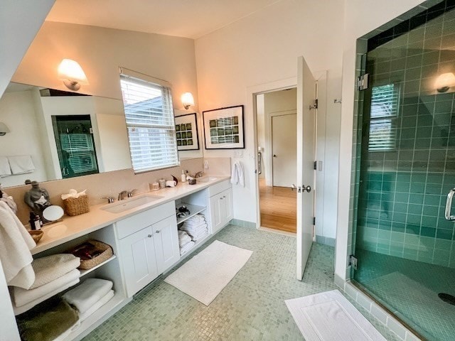 bathroom featuring vanity, tile patterned flooring, and an enclosed shower