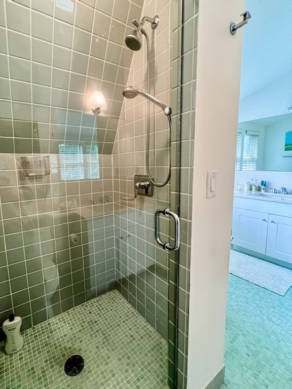 bathroom with vanity and walk in shower