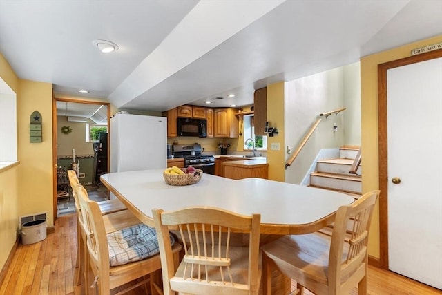 12 Clarner Rd, Lynn, MA 01904 - dining space with light wood-style flooring, stairs, and recessed lighting