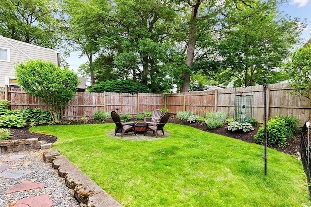 12 Clarner Rd, Lynn, MA 01904 - fenced backyard with an outdoor fire pit