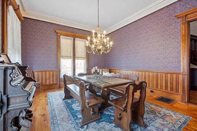 4 W Broadway, Gardner, MA 01440 - dining room featuring a notable chandelier, a wainscoted wall, hardwood / wood-style floors, and crown molding