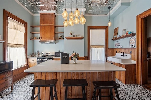 4 W Broadway, Gardner, MA 01440 - kitchen featuring ornamental molding, gas stove, black microwave, open shelves, and an ornate ceiling