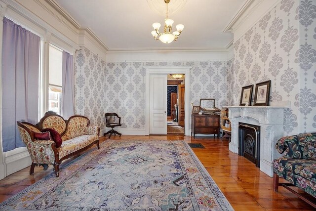 4 W Broadway, Gardner, MA 01440 - sitting room featuring crown molding, a chandelier, wood finished floors, and a high end fireplace