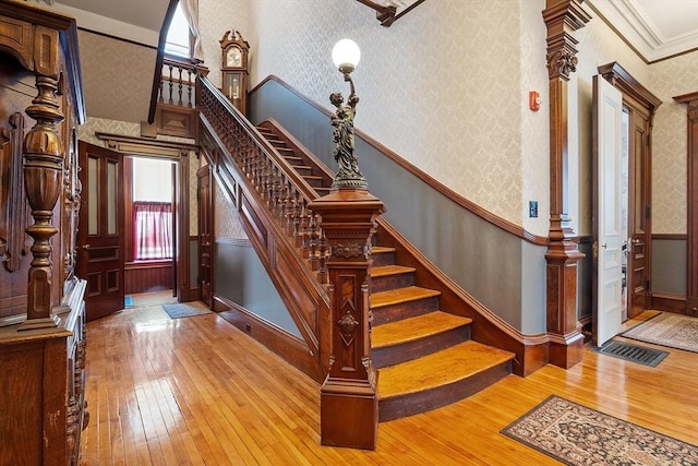 4 W Broadway, Gardner, MA 01440 - staircase with wood-type flooring, wainscoting, visible vents, and wallpapered walls